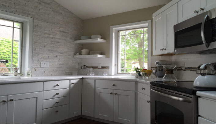 Transitional kitchen remodel done with cabinet refacing.