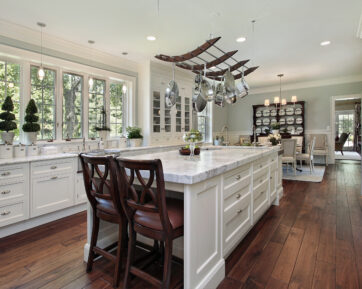 White quartz island with a white shaker cabinetry