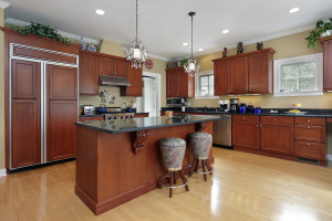 Kitchen in luxury home with cherrywood cabinetry
